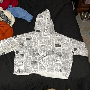 Cropped news letter sweater
